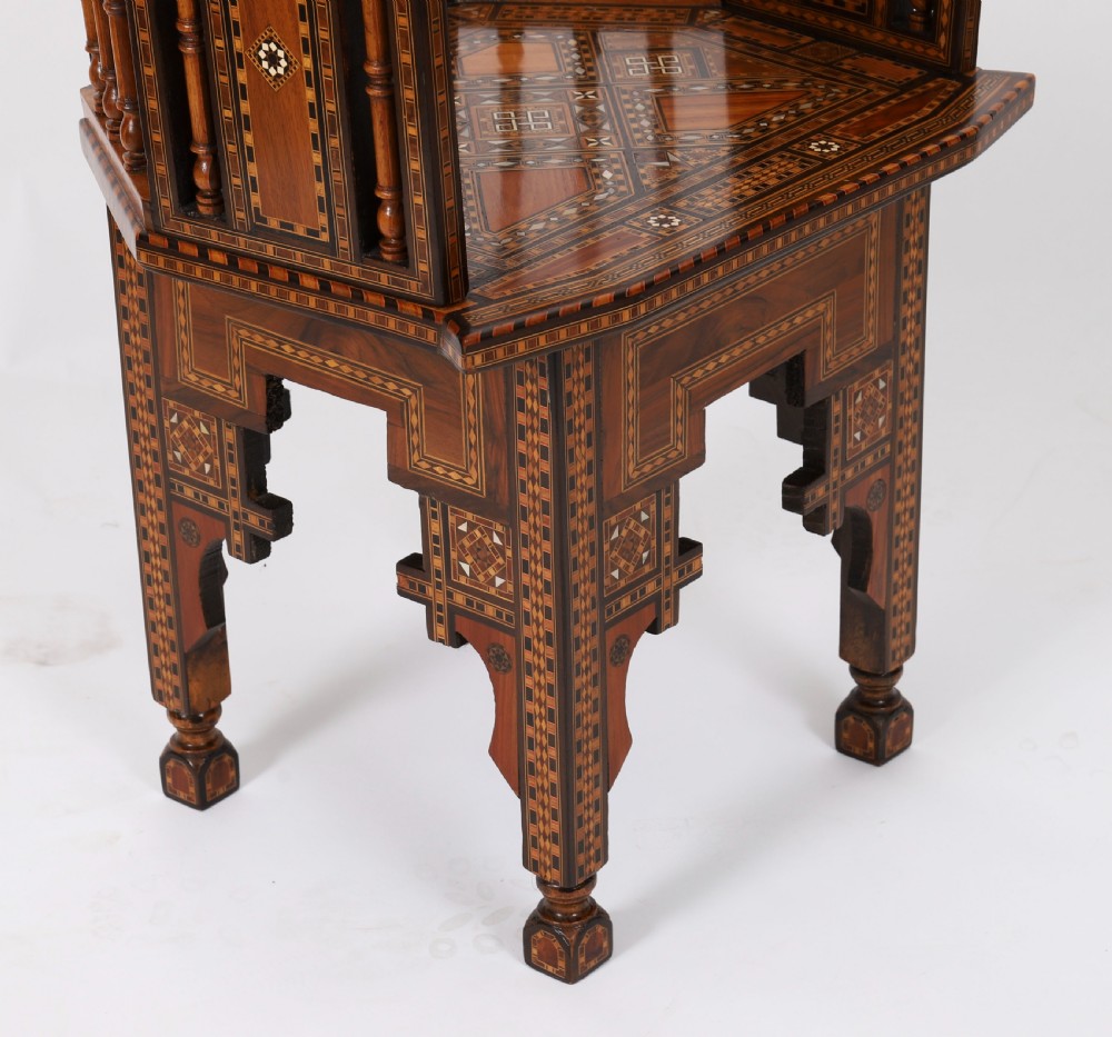A pair of 19th-century Levantine armchairs decorated with geometric wood parquetry, mother-of-pearl inlay, turned side spindles, and stepped crest rails. View XI