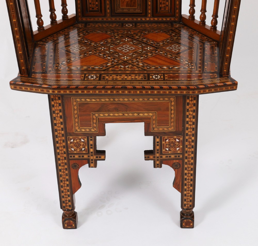 A pair of 19th-century Levantine armchairs decorated with geometric wood parquetry, mother-of-pearl inlay, turned side spindles, and stepped crest rails. View XVI
