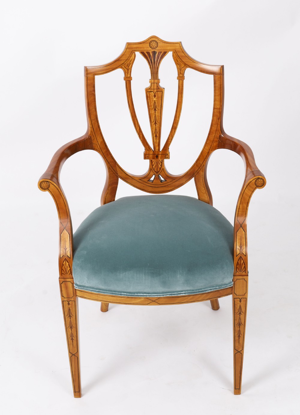 A set of eight antique satinwood shieldback dining chairs featuring classical marquetry inlay and teal velvet seats. View II