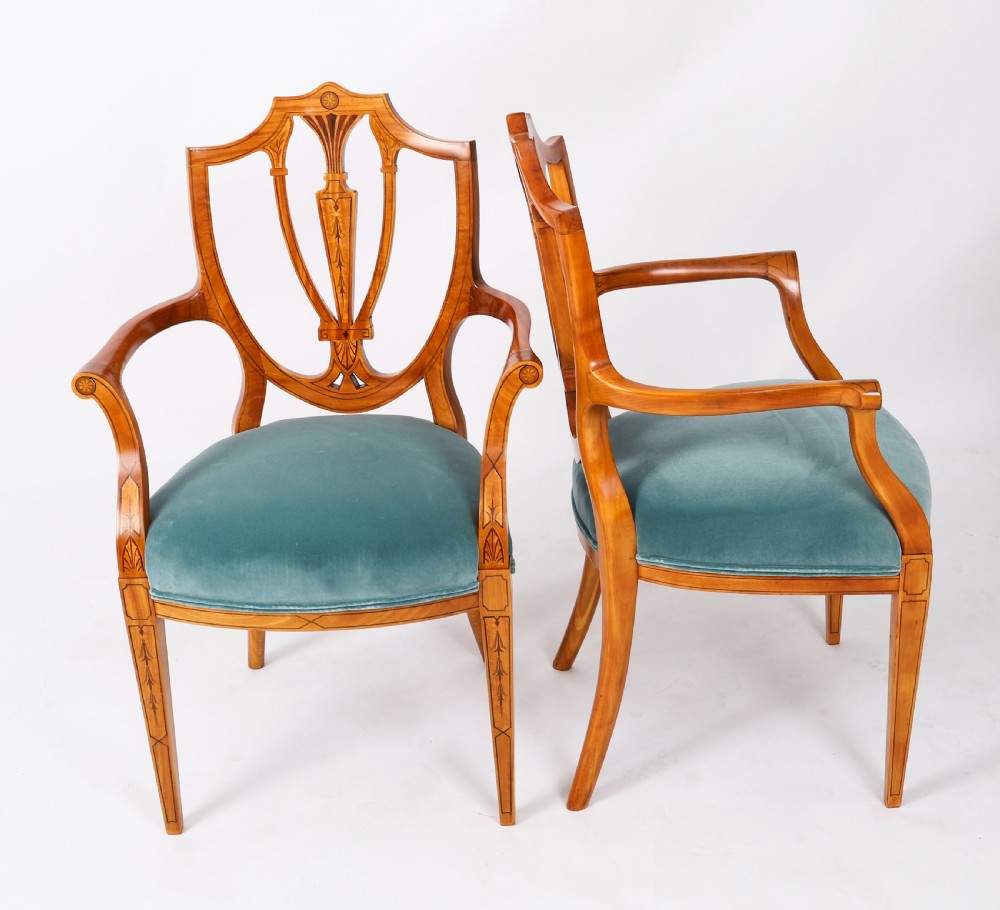 A set of eight antique satinwood shieldback dining chairs featuring classical marquetry inlay and teal velvet seats. View IV