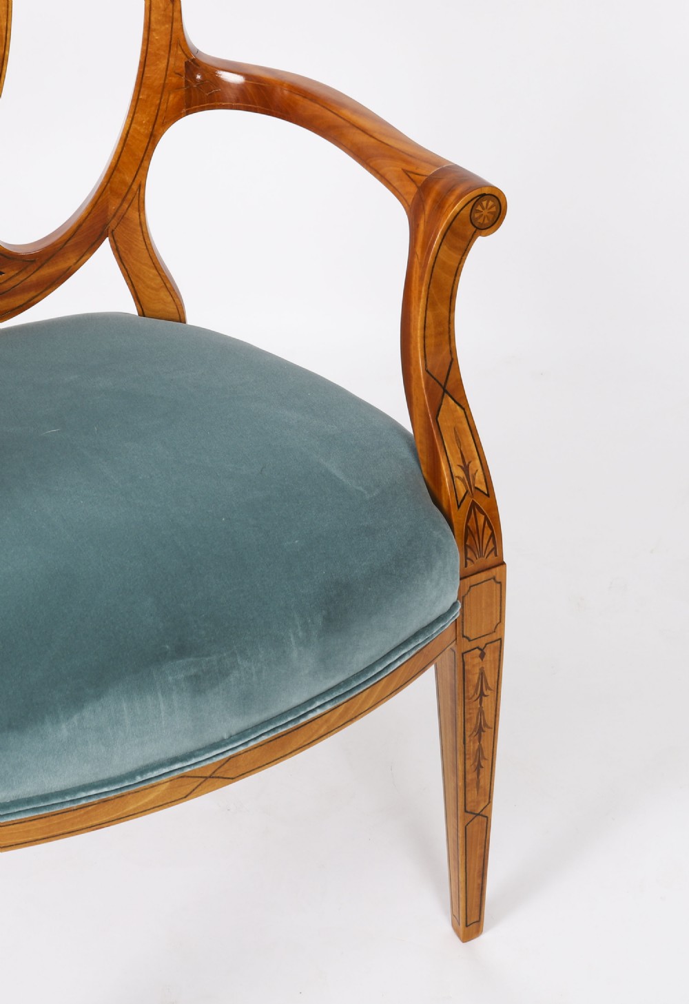 A set of eight antique satinwood shieldback dining chairs featuring classical marquetry inlay and teal velvet seats. View VII