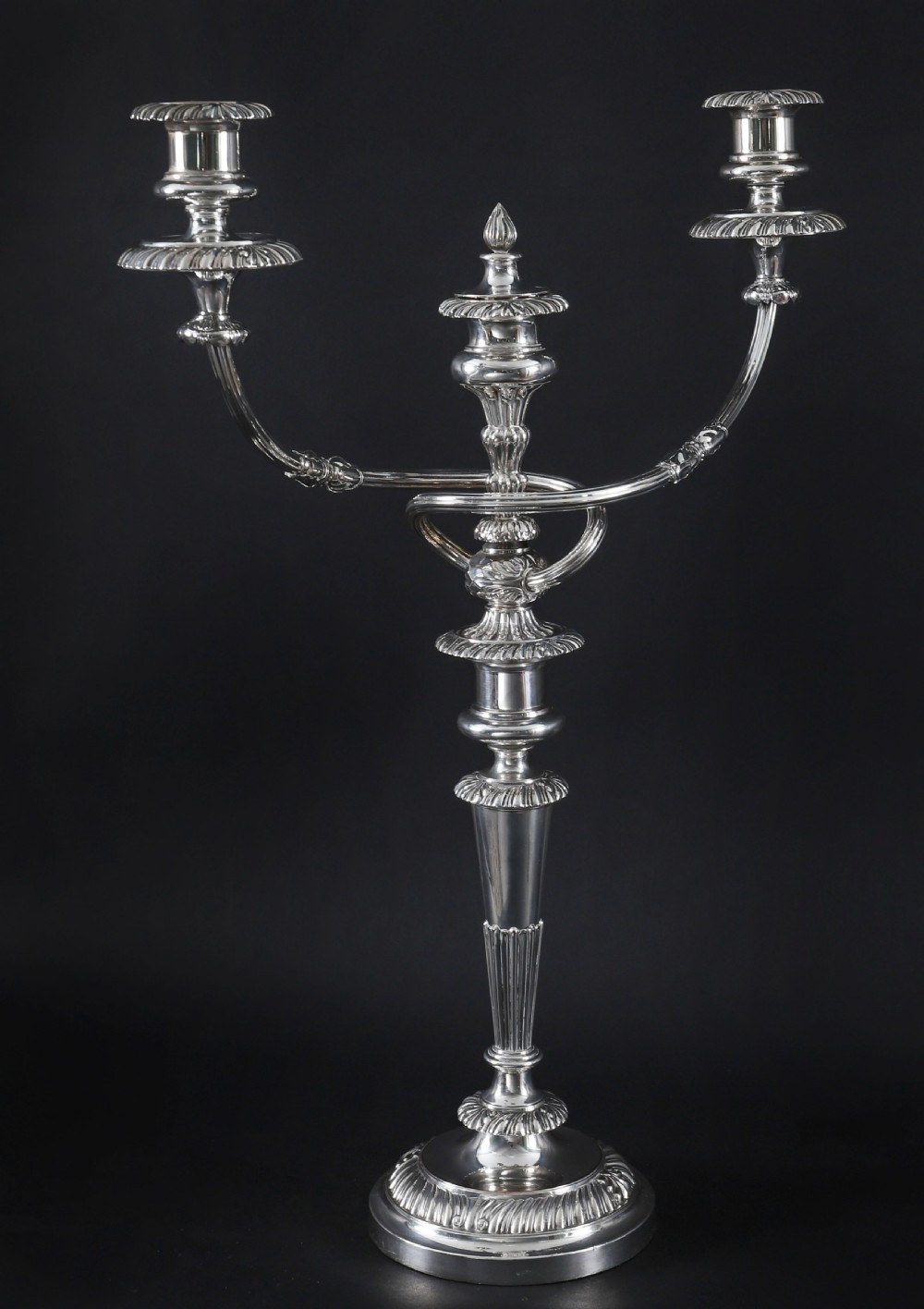 A pair of silver three-light candelabra featuring fluted columns, reeded scrolling branches, and gadrooned rims on circular bases. View IV