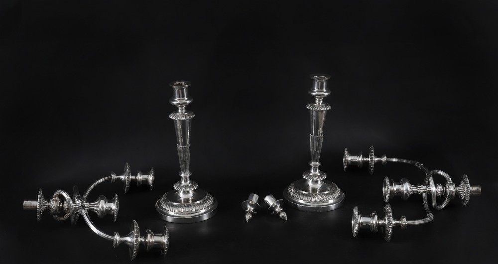 A pair of silver three-light candelabra featuring fluted columns, reeded scrolling branches, and gadrooned rims on circular bases. View XI
