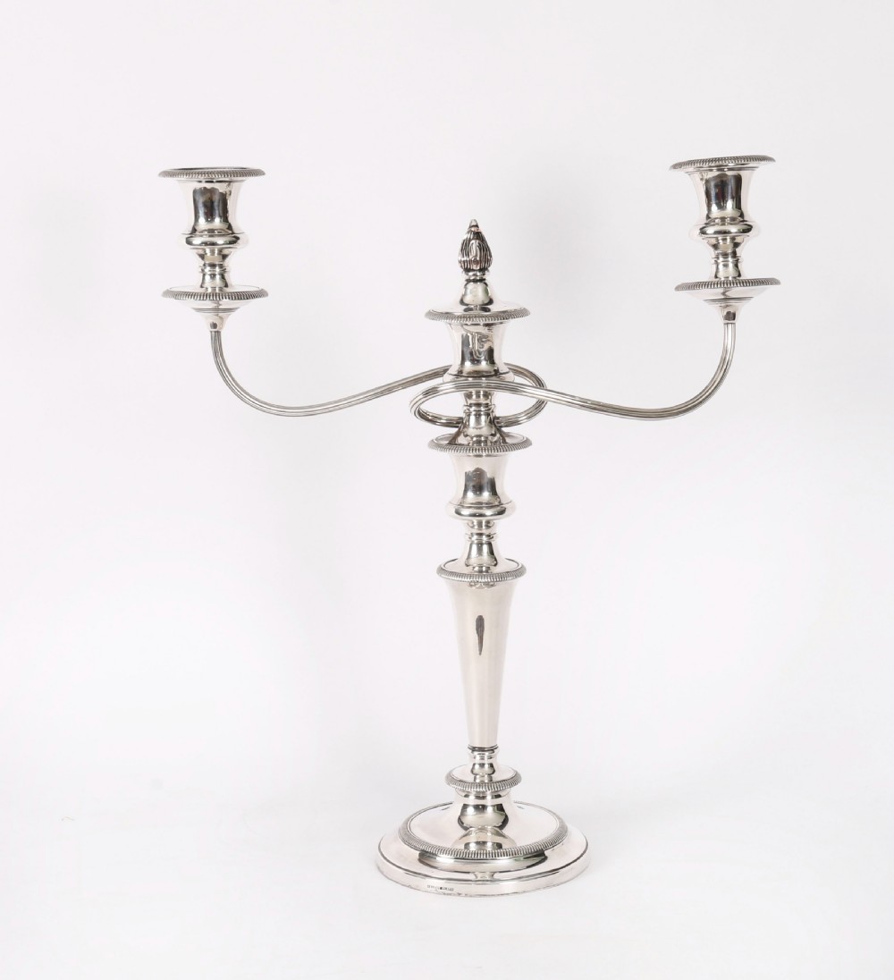 A pair of late nineteenth-century silver three-light candelabra featuring reeded curving arms, beaded circular bases, and central flame finials. View XI