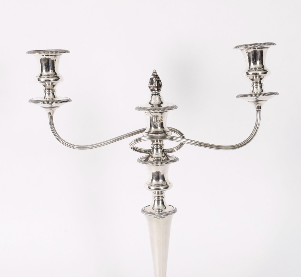 A pair of late nineteenth-century silver three-light candelabra featuring reeded curving arms, beaded circular bases, and central flame finials. View XII