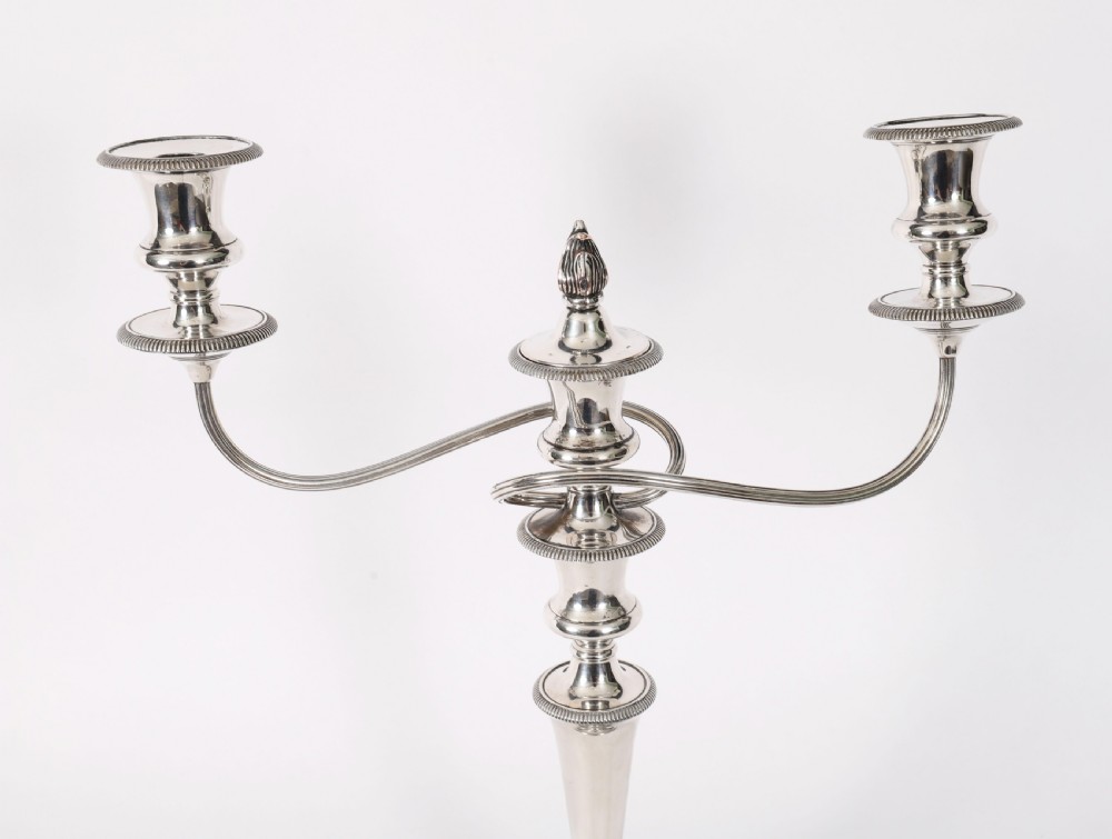 A pair of late nineteenth-century silver three-light candelabra featuring reeded curving arms, beaded circular bases, and central flame finials. View XIII