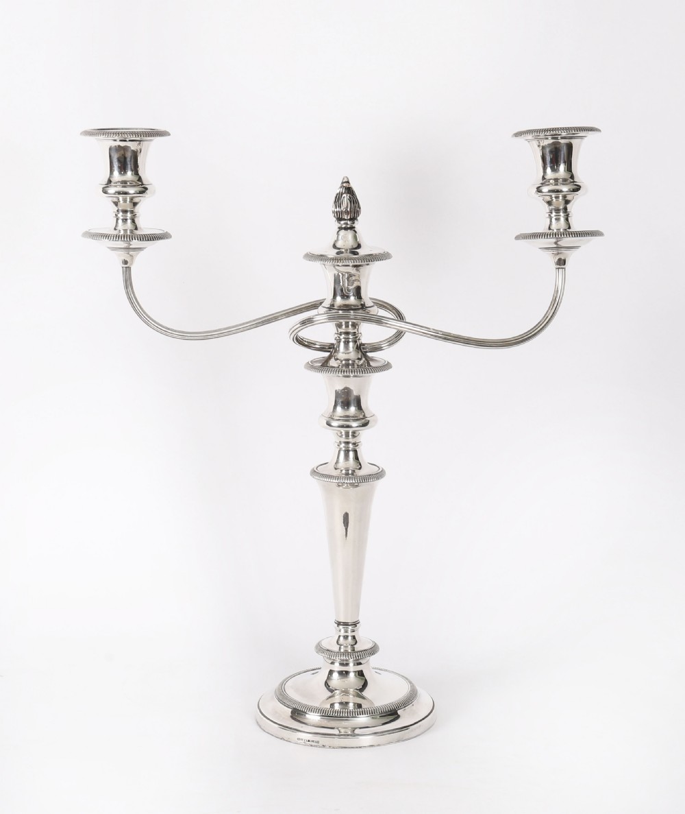 A pair of late nineteenth-century silver three-light candelabra featuring reeded curving arms, beaded circular bases, and central flame finials. View XVII