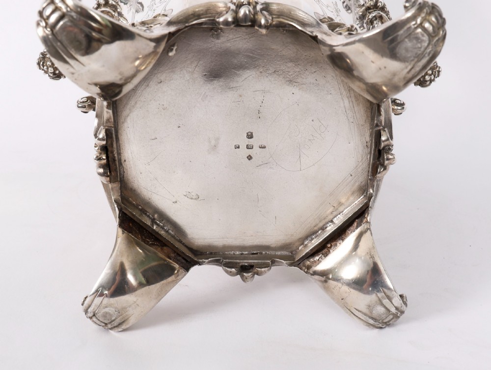 A nineteenth-century silver-plated wine cooler featuring engraved panels, cast scroll feet, side handles, and a gilded interior wash. View XIV