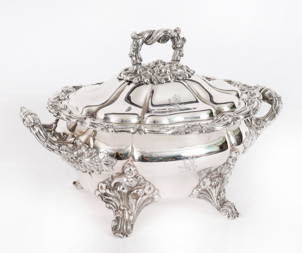 A pair of silver-plated oval sauce tureens featuring domed lids, foliate scroll handles, and decorative carved feet. View II