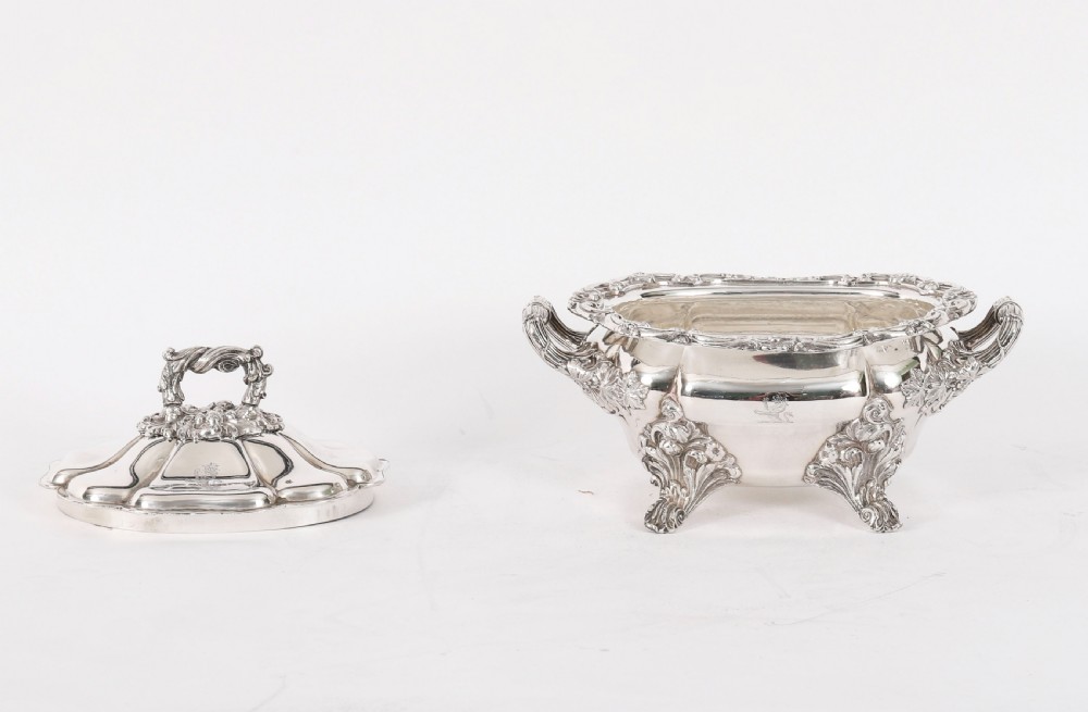 A pair of silver-plated oval sauce tureens featuring domed lids, foliate scroll handles, and decorative carved feet. View VII