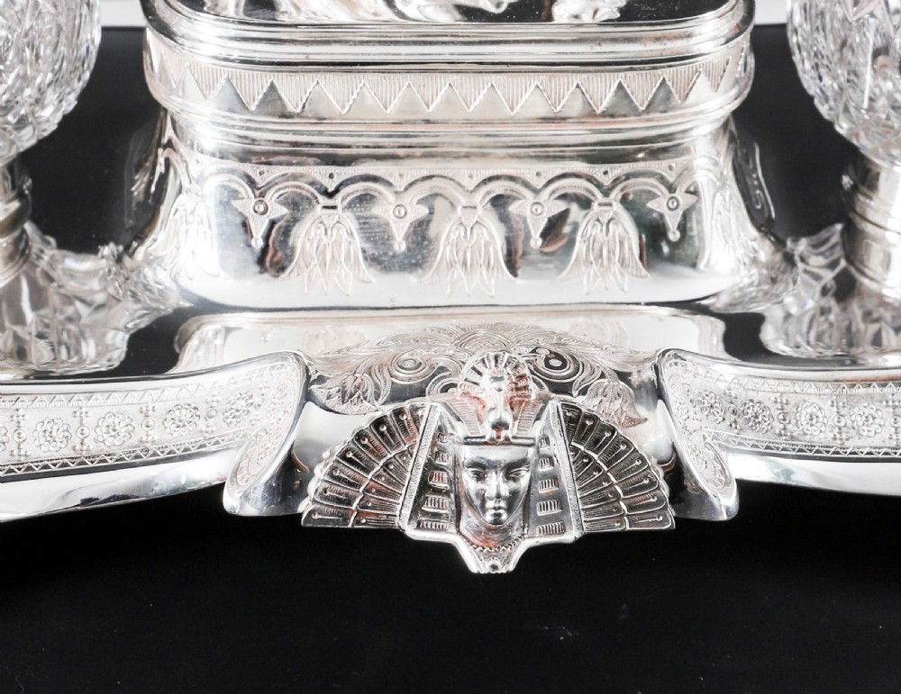 A Victorian silver-plated inkstand featuring a central winged sphinx sculpture flanked by two cut glass inkwell bottles. View VIII