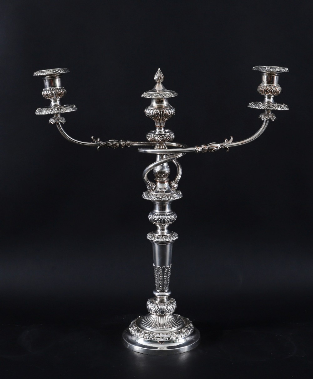 A four-piece set of 18th-century George III Old Sheffield silver-plated candelabra and matching candlesticks with fluted stems and leaf motifs. View II