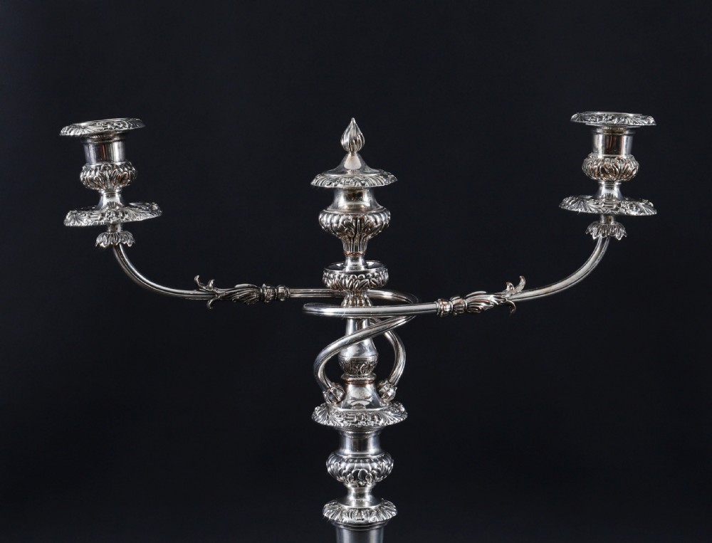 A four-piece set of 18th-century George III Old Sheffield silver-plated candelabra and matching candlesticks with fluted stems and leaf motifs. View III
