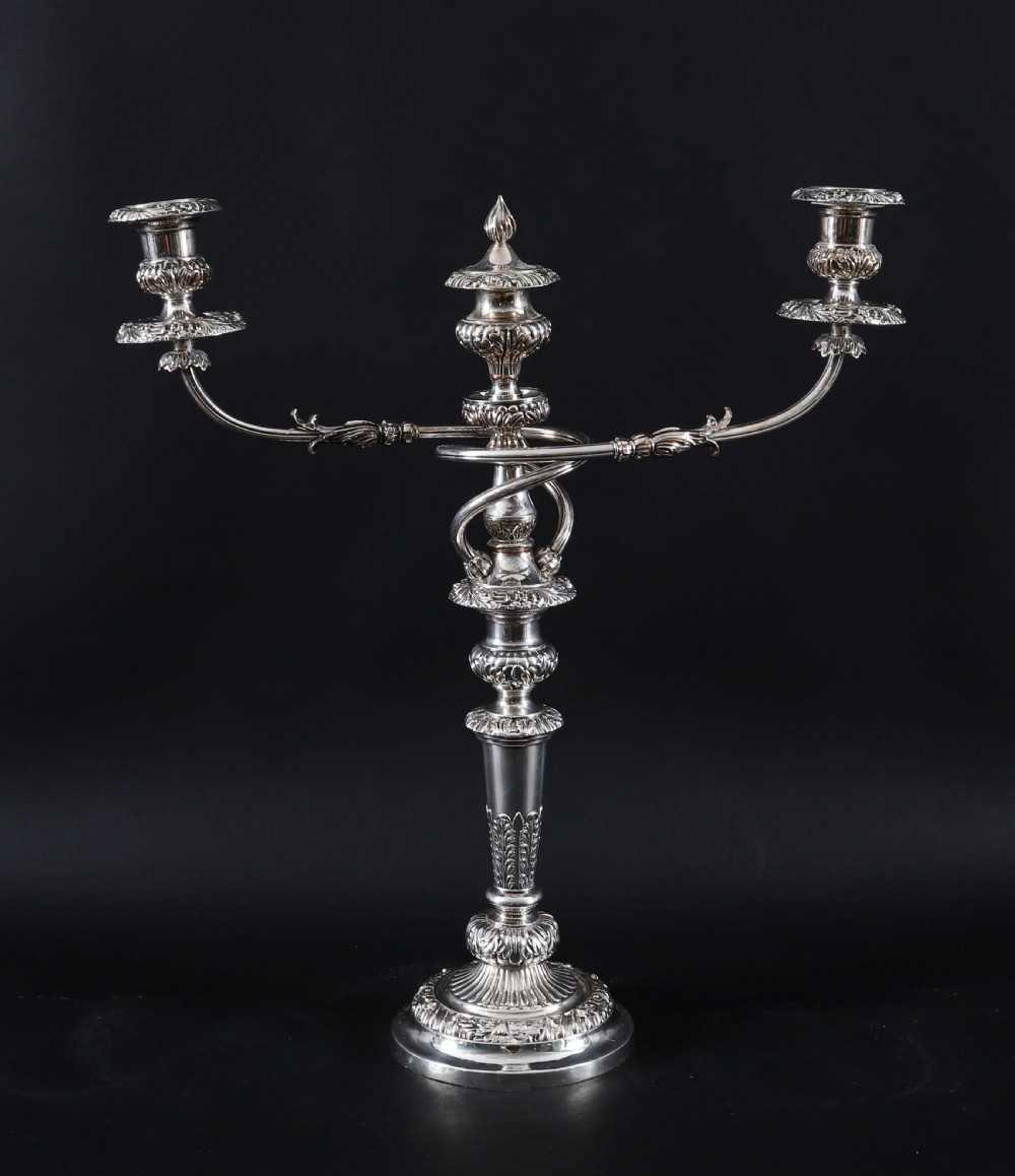 A four-piece set of 18th-century George III Old Sheffield silver-plated candelabra and matching candlesticks with fluted stems and leaf motifs. View VIII