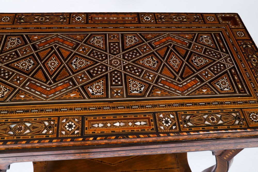 An antique Levantine folding games table featuring geometric marquetry and bone inlays on cabriole legs with a lower shelf. View X