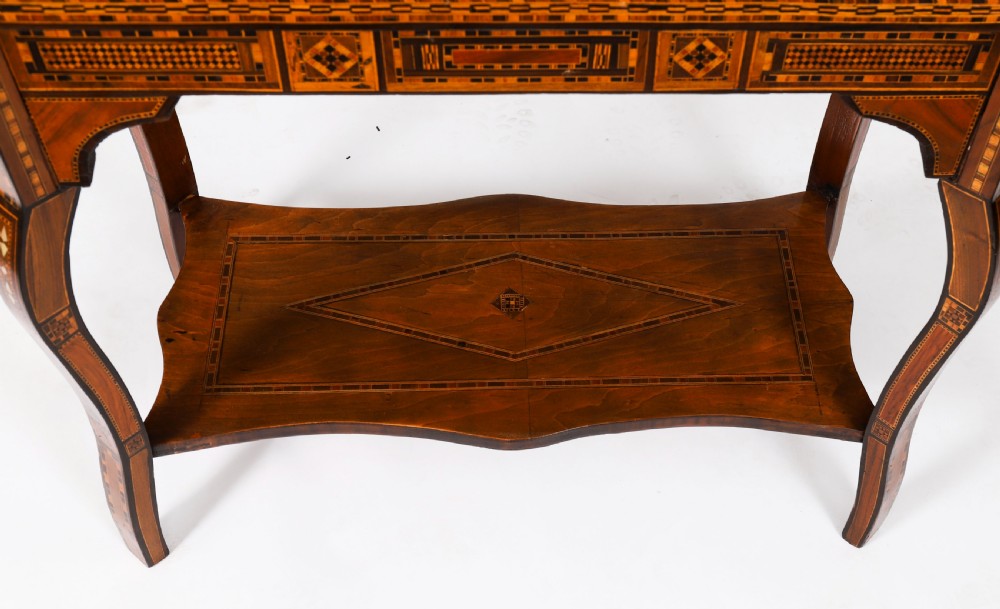 An antique Levantine folding games table featuring geometric marquetry and bone inlays on cabriole legs with a lower shelf. View XII