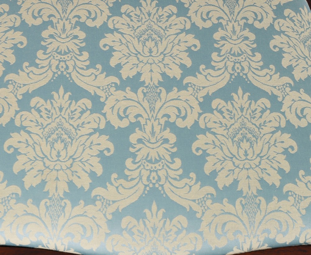 A pair of 20th-century mahogany Federal Revival armchairs featuring carved shield backs with central urn splats and blue patterned damask seats. View XI