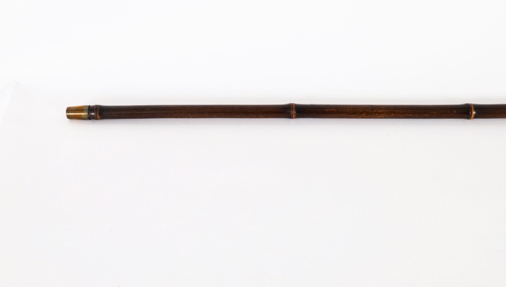 A 19th-century French walking stick featuring a dark wood shaft and a gold-plated pommel adorned with painted porcelain inserts. View V