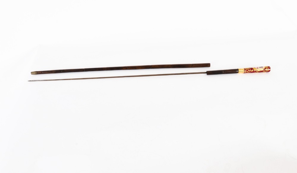 A nineteenth-century French walking stick featuring a dark wood shaft, a gilt metal band, and a hand-painted porcelain pommel handle. View III