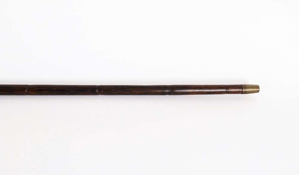 A nineteenth-century French walking stick featuring a dark wood shaft, a gilt metal band, and a hand-painted porcelain pommel handle. View VII