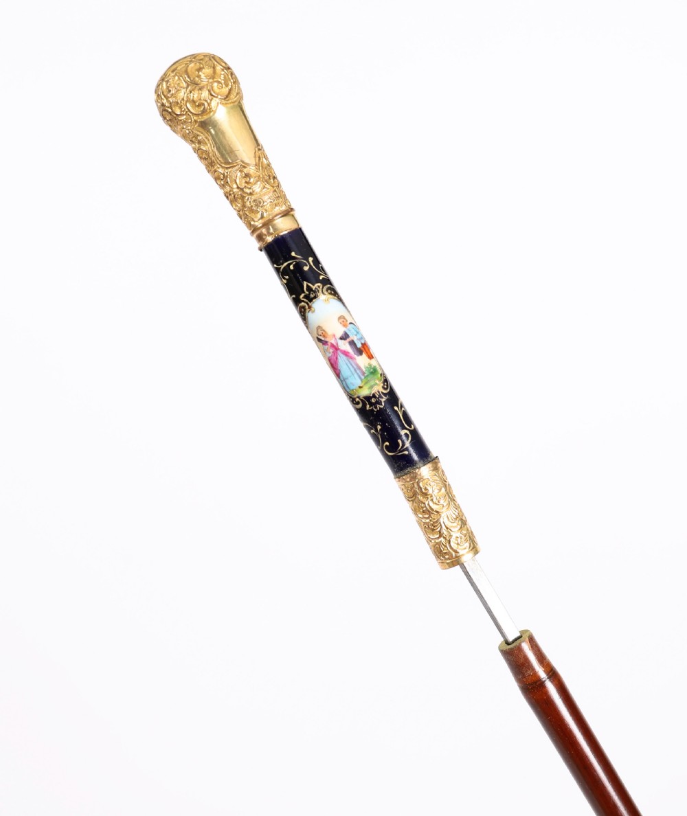 A nineteenth-century French walking cane featuring a dark wooden shaft, a concealed steel blade, and a gilt metal handle mounted with painted Sevres porcelain. View II