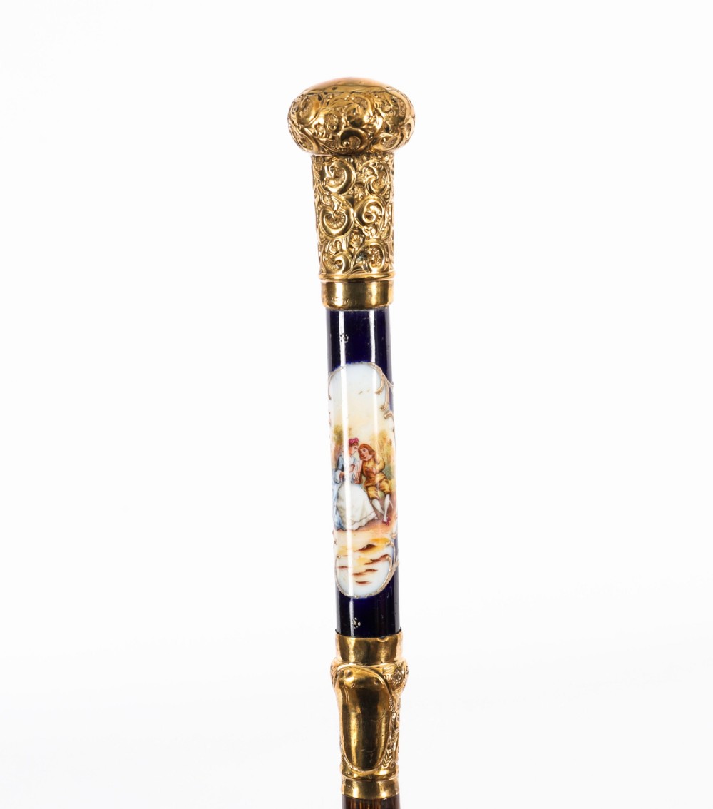 A nineteenth-century French walking cane featuring a dark wooden shaft, a concealed steel blade, and a gilt metal handle mounted with painted Sevres porcelain. View III