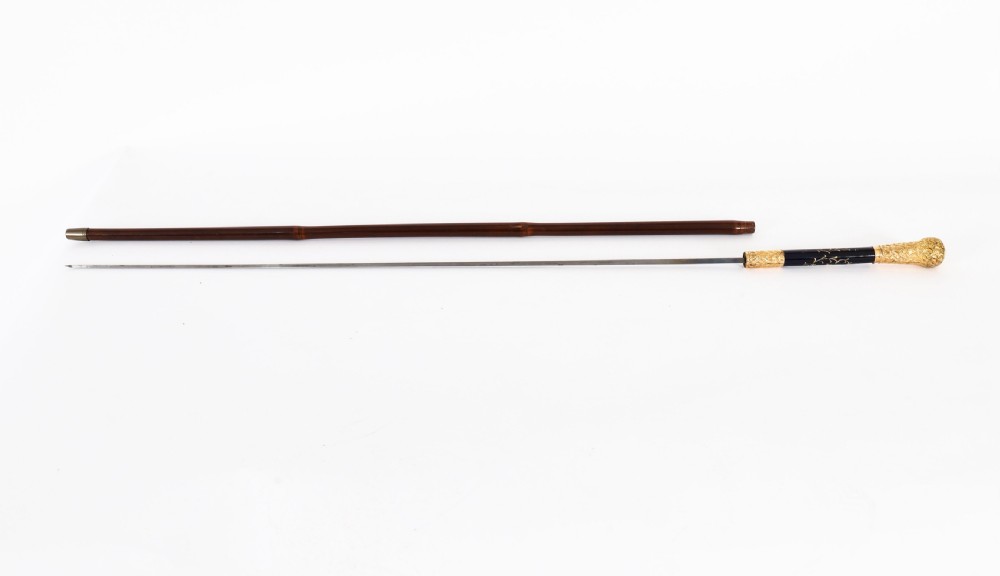 A nineteenth-century French walking cane featuring a dark wooden shaft, a concealed steel blade, and a gilt metal handle mounted with painted Sevres porcelain. View IV