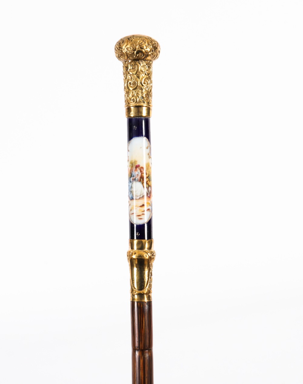 A nineteenth-century French walking cane featuring a dark wooden shaft, a concealed steel blade, and a gilt metal handle mounted with painted Sevres porcelain. View XIII