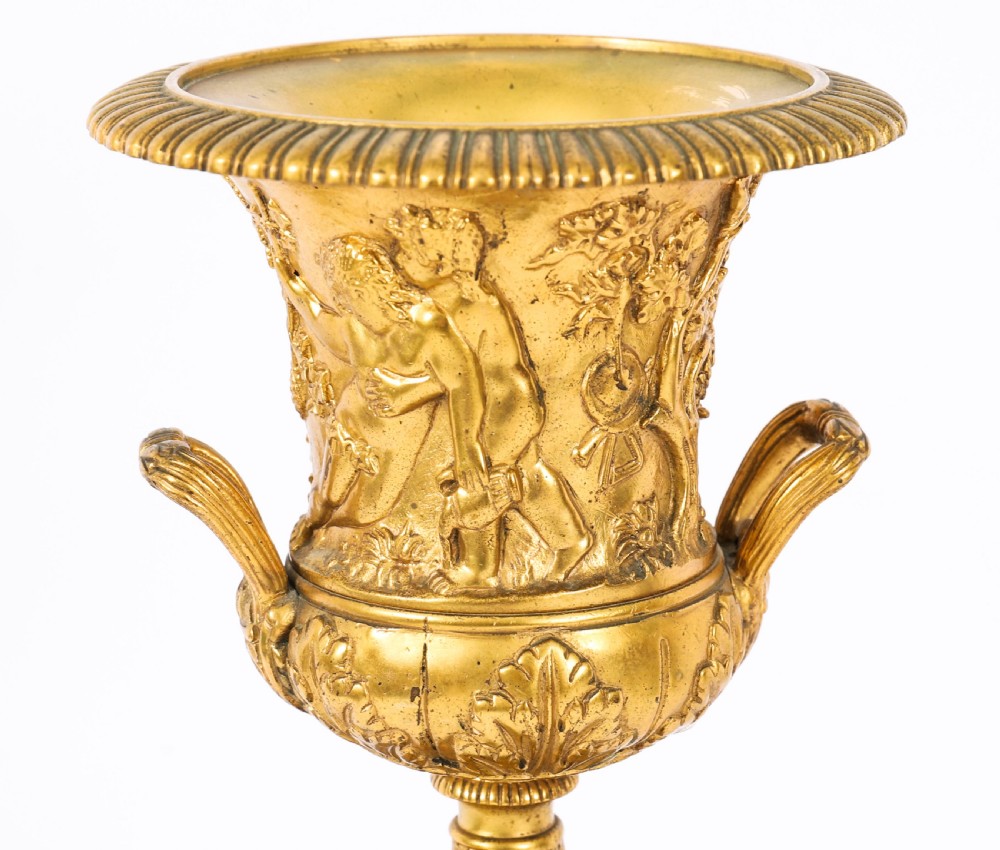 A pair of 19th-century French Grand Tour gilt bronze campana urns featuring classical figure reliefs, mounted on square green marble pedestal bases with gilt laurel wreaths. View VII