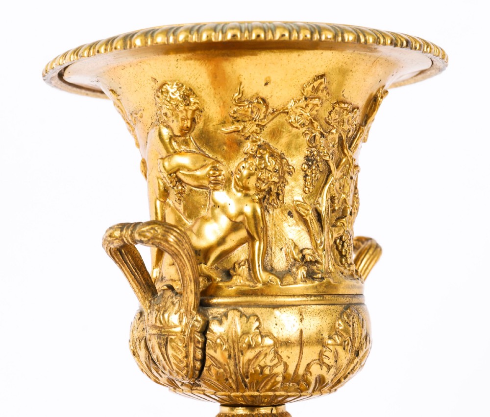 A pair of 19th-century French Grand Tour gilt bronze campana urns featuring classical figure reliefs, mounted on square green marble pedestal bases with gilt laurel wreaths. View VIII