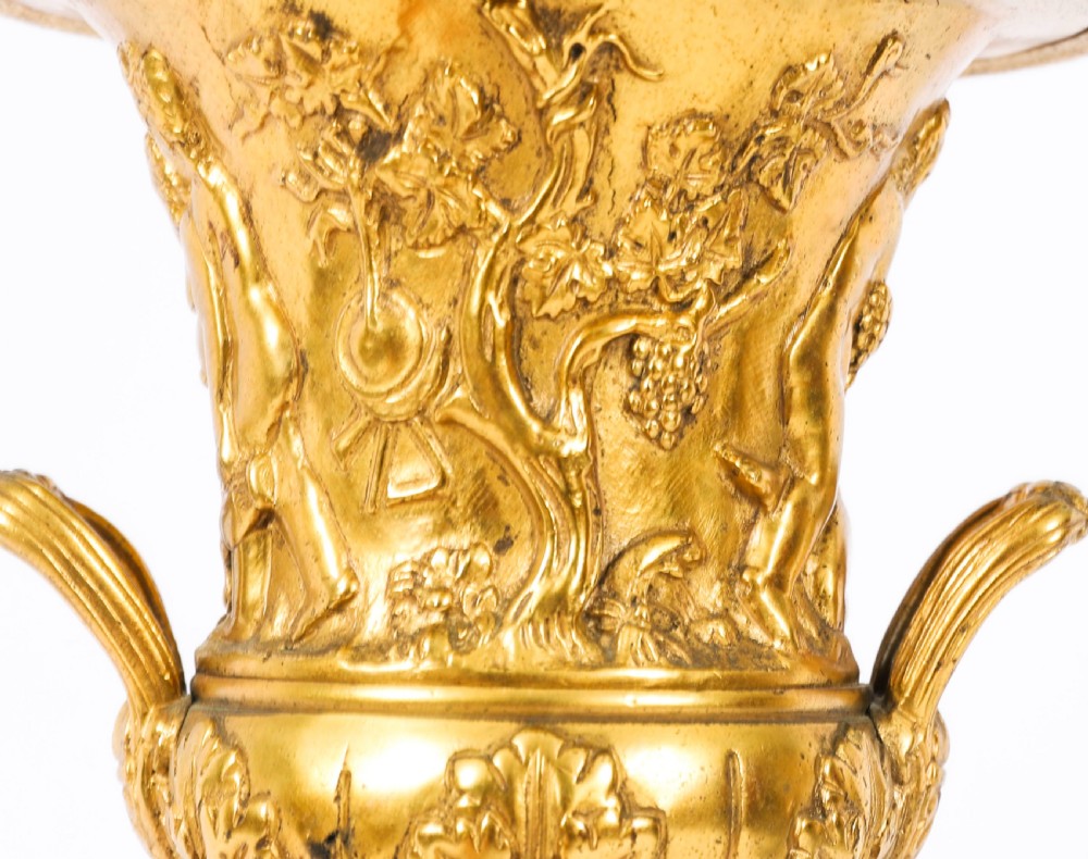 A pair of 19th-century French Grand Tour gilt bronze campana urns featuring classical figure reliefs, mounted on square green marble pedestal bases with gilt laurel wreaths. View IX