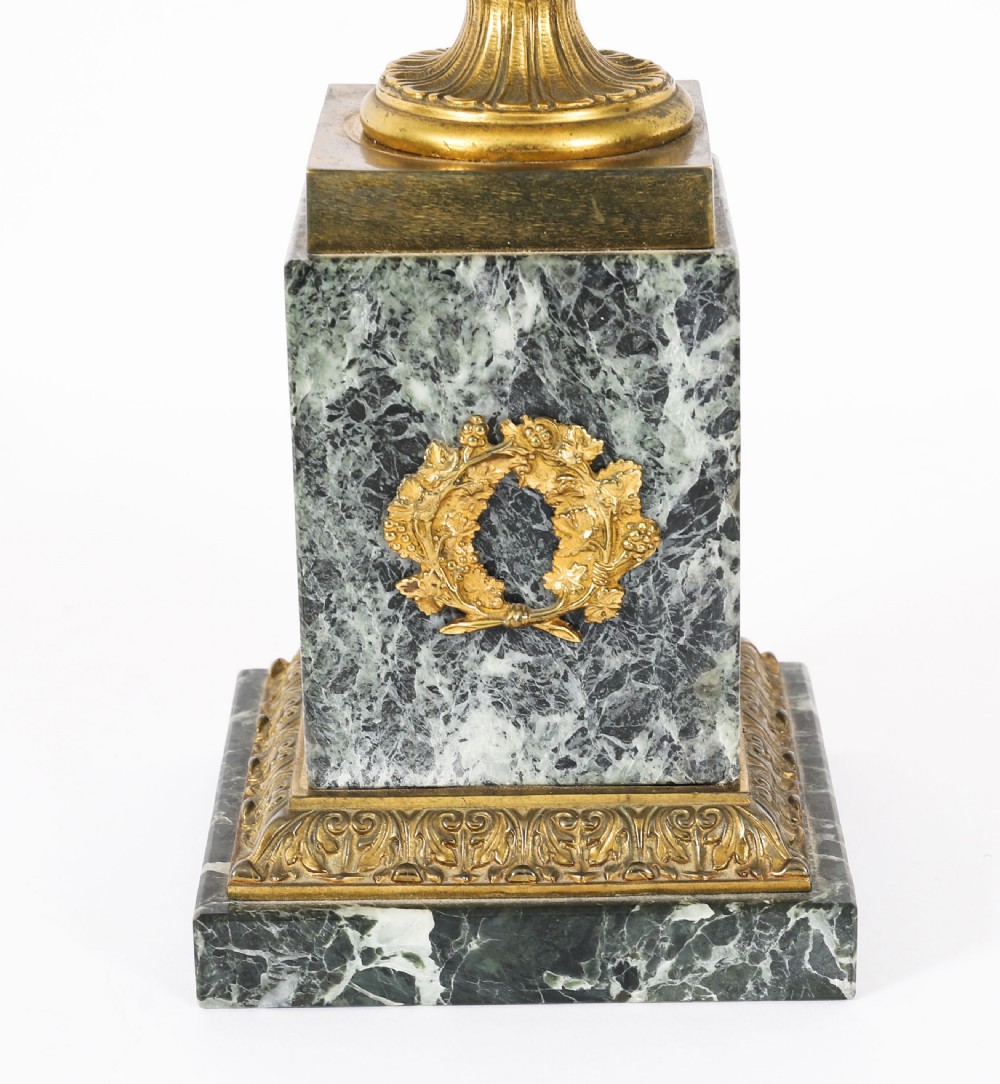 A pair of 19th-century French Grand Tour gilt bronze campana urns featuring classical figure reliefs, mounted on square green marble pedestal bases with gilt laurel wreaths. View XI