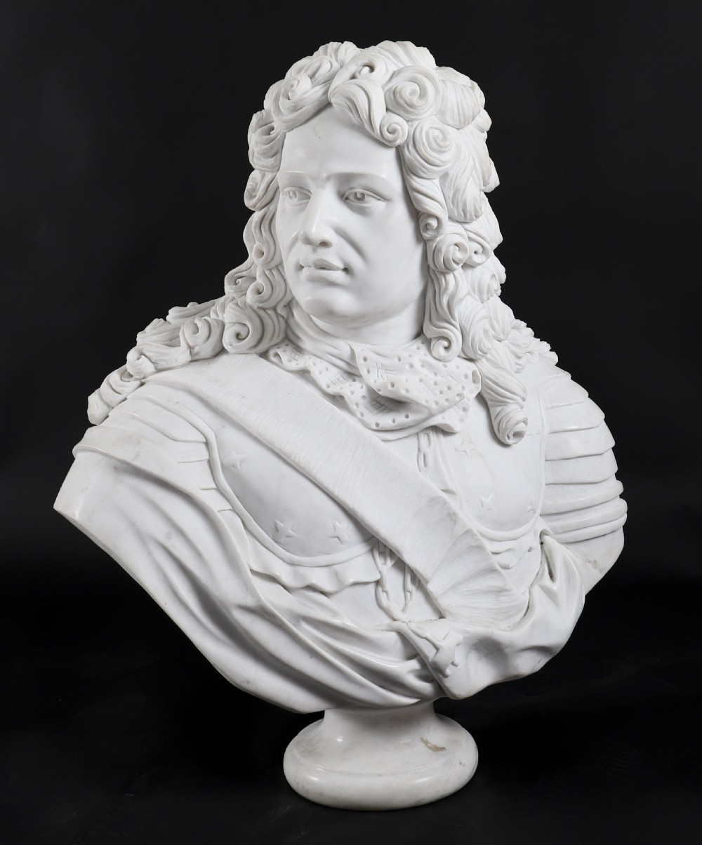 Carved white marble bust depicting a nobleman with long curled hair, lace cravat, and plate armour on a turned circular pedestal. View II