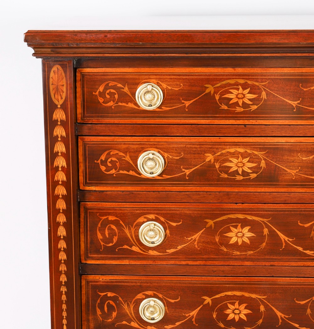An Edwardian mahogany Wellington chest featuring eight inlaid drawers, satinwood floral motifs, a right-side locking stile, and brass handles. View VII