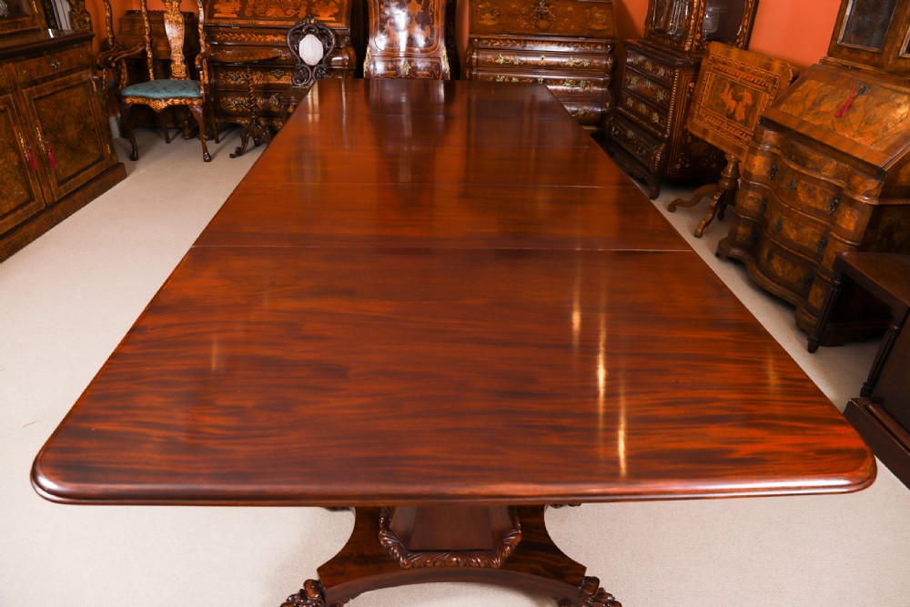 An extendable George IV Regency mahogany twin pedestal dining table with carved paw feet. View III