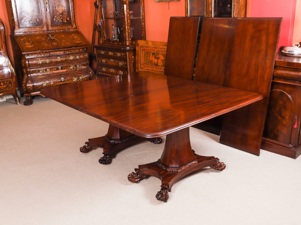 An extendable George IV Regency mahogany twin pedestal dining table with carved paw feet. View VIII