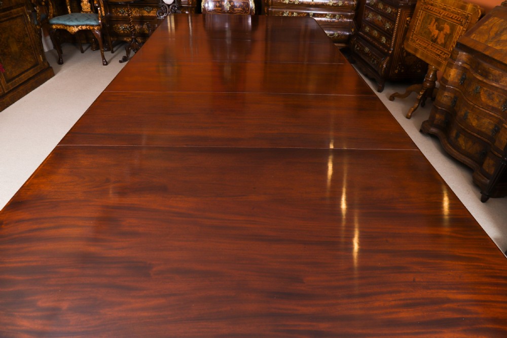 An extendable George IV Regency mahogany twin pedestal dining table with carved paw feet. View XIV