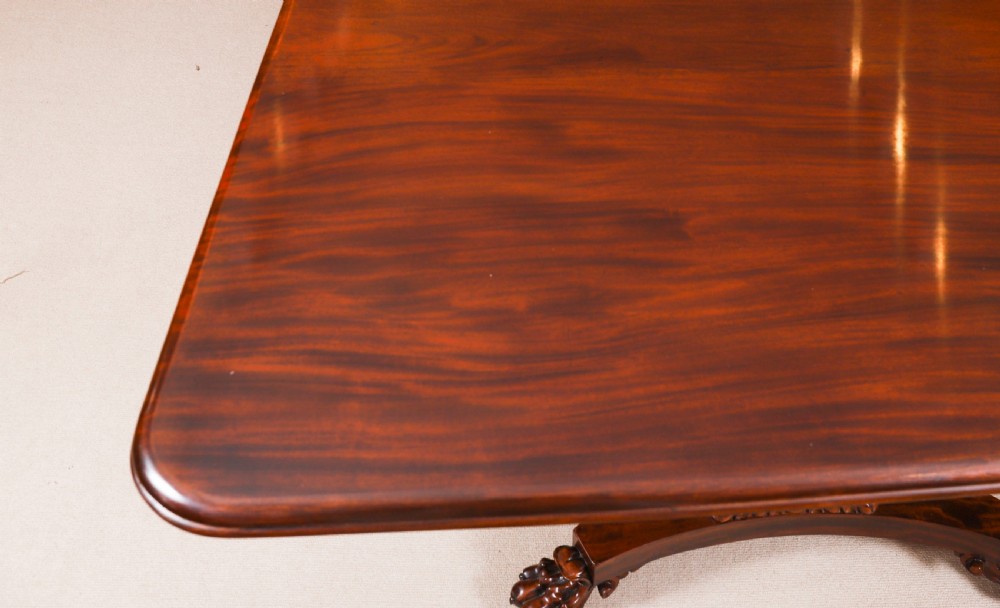 An extendable George IV Regency mahogany twin pedestal dining table with carved paw feet. View XVI