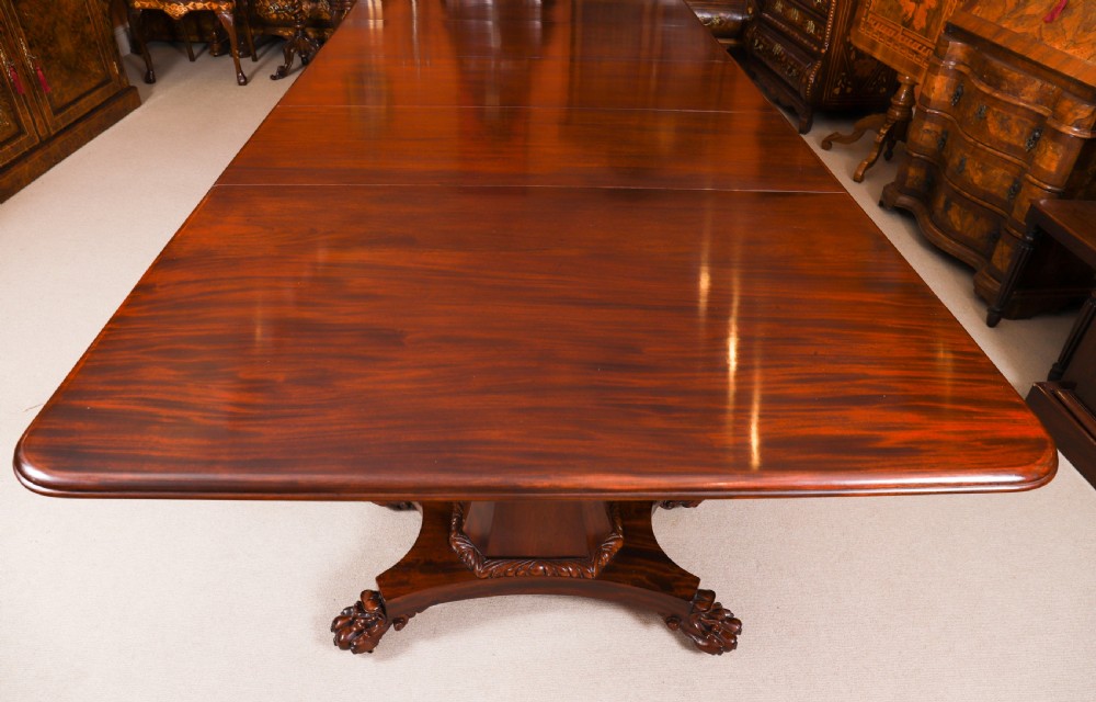 An extendable George IV Regency mahogany twin pedestal dining table with carved paw feet. View XVII
