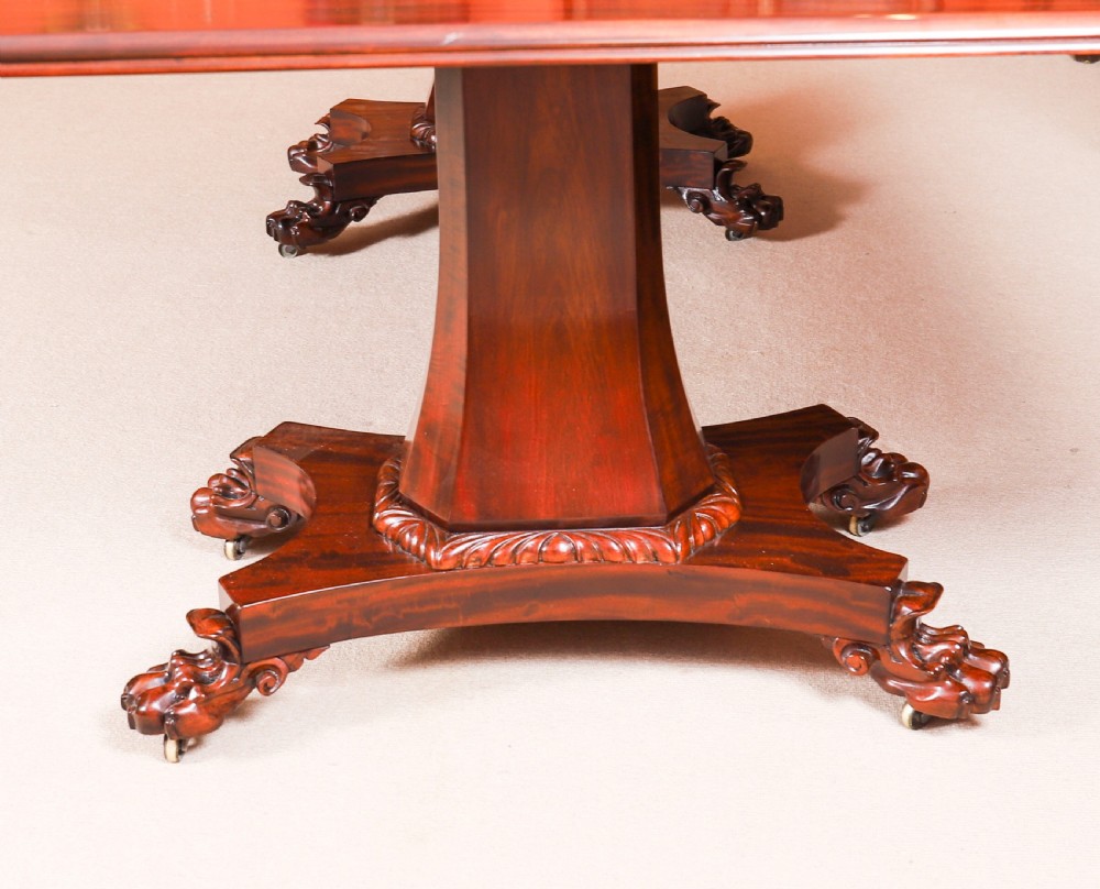 An extendable George IV Regency mahogany twin pedestal dining table with carved paw feet. View XVIII