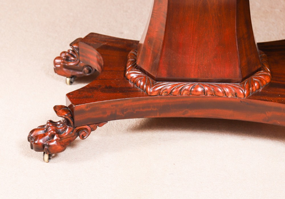 An extendable George IV Regency mahogany twin pedestal dining table with carved paw feet. View XIX