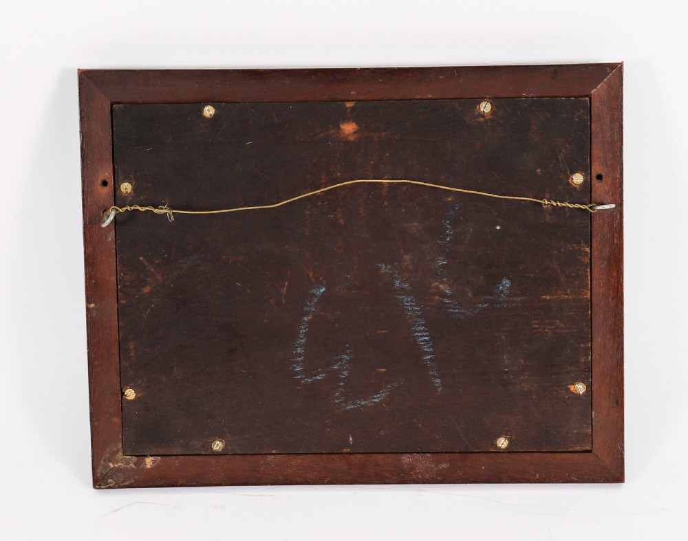 A dark wooden moulding frame housing six white plaster classical intaglio impressions set against a dark brown velvet background. View VI