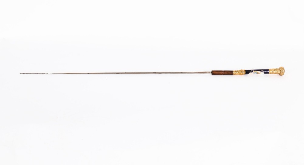 A 19th-century French sword stick featuring a chased gold-plated pommel and a hand-painted Sevres style cobalt blue porcelain collar above a wooden shaft with a partially drawn steel blade. View VI