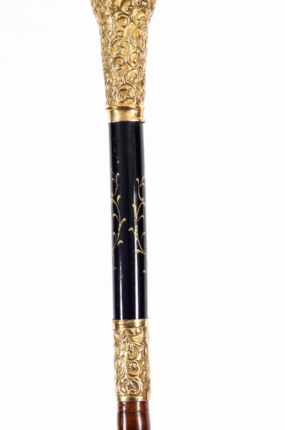 A 19th-century French sword stick featuring a chased gold-plated pommel and a hand-painted Sevres style cobalt blue porcelain collar above a wooden shaft with a partially drawn steel blade. View X