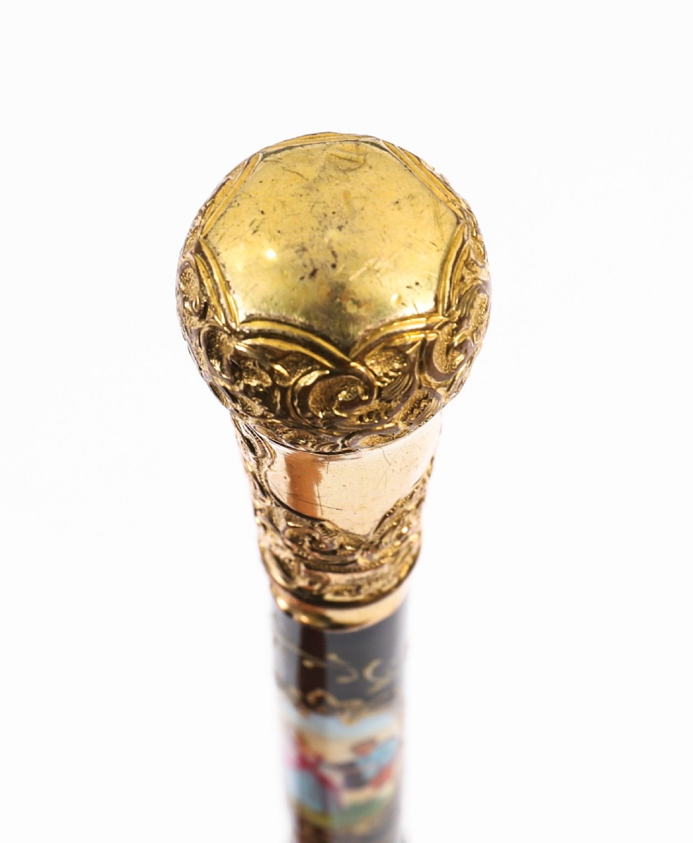 A 19th-century French sword stick featuring a chased gold-plated pommel and a hand-painted Sevres style cobalt blue porcelain collar above a wooden shaft with a partially drawn steel blade. View XIV