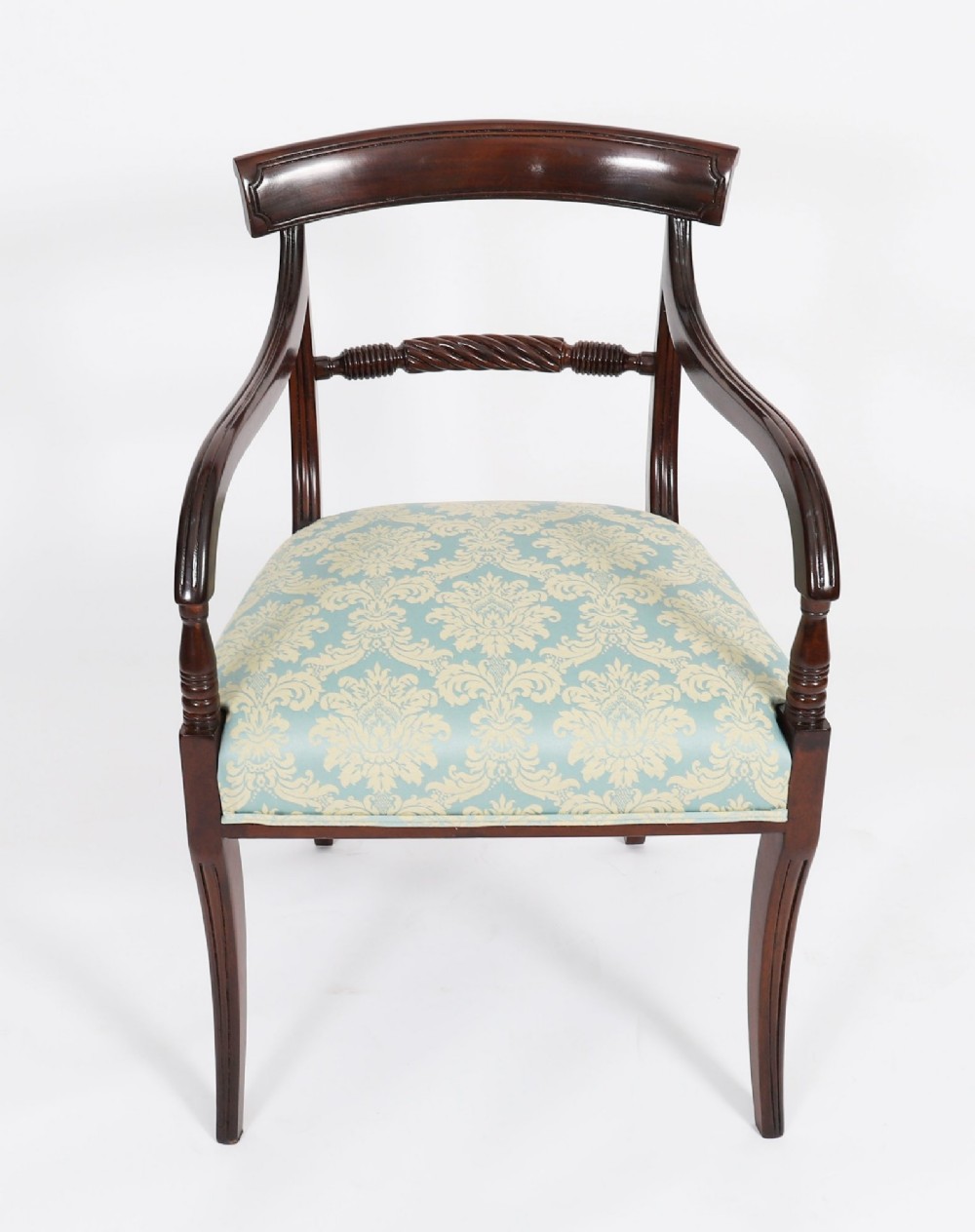 A set of eight Regency mahogany dining chairs, including two carvers, featuring curved top rails, rope-twist splats, and pale blue patterned upholstered seats. View VI