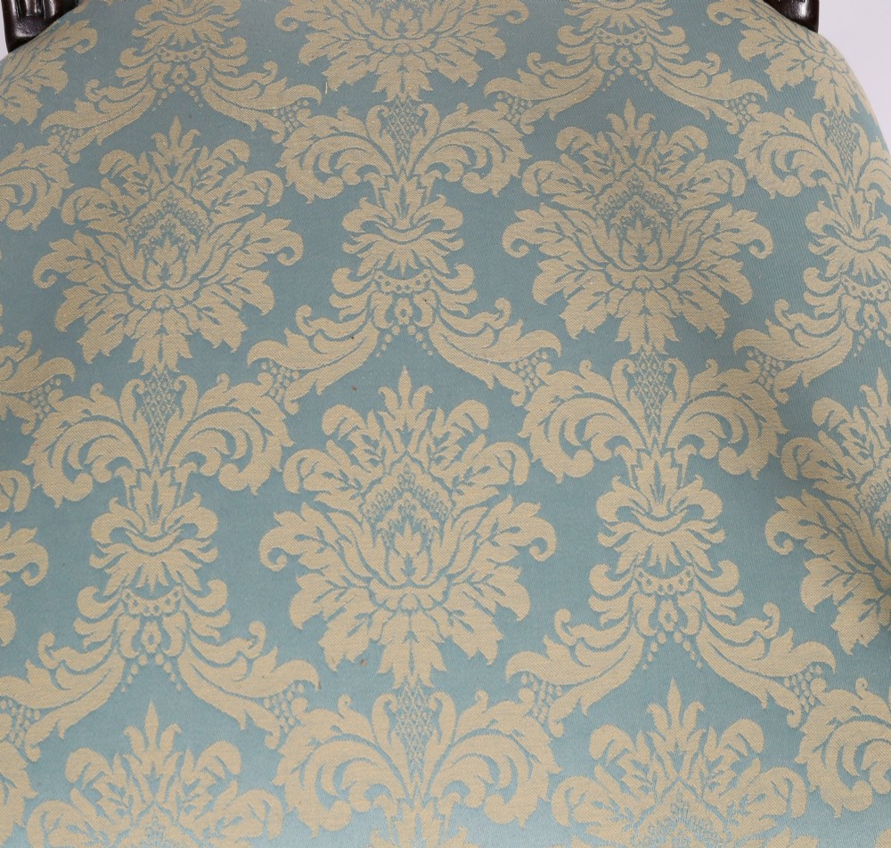 A set of eight Regency mahogany dining chairs, including two carvers, featuring curved top rails, rope-twist splats, and pale blue patterned upholstered seats. View VIII