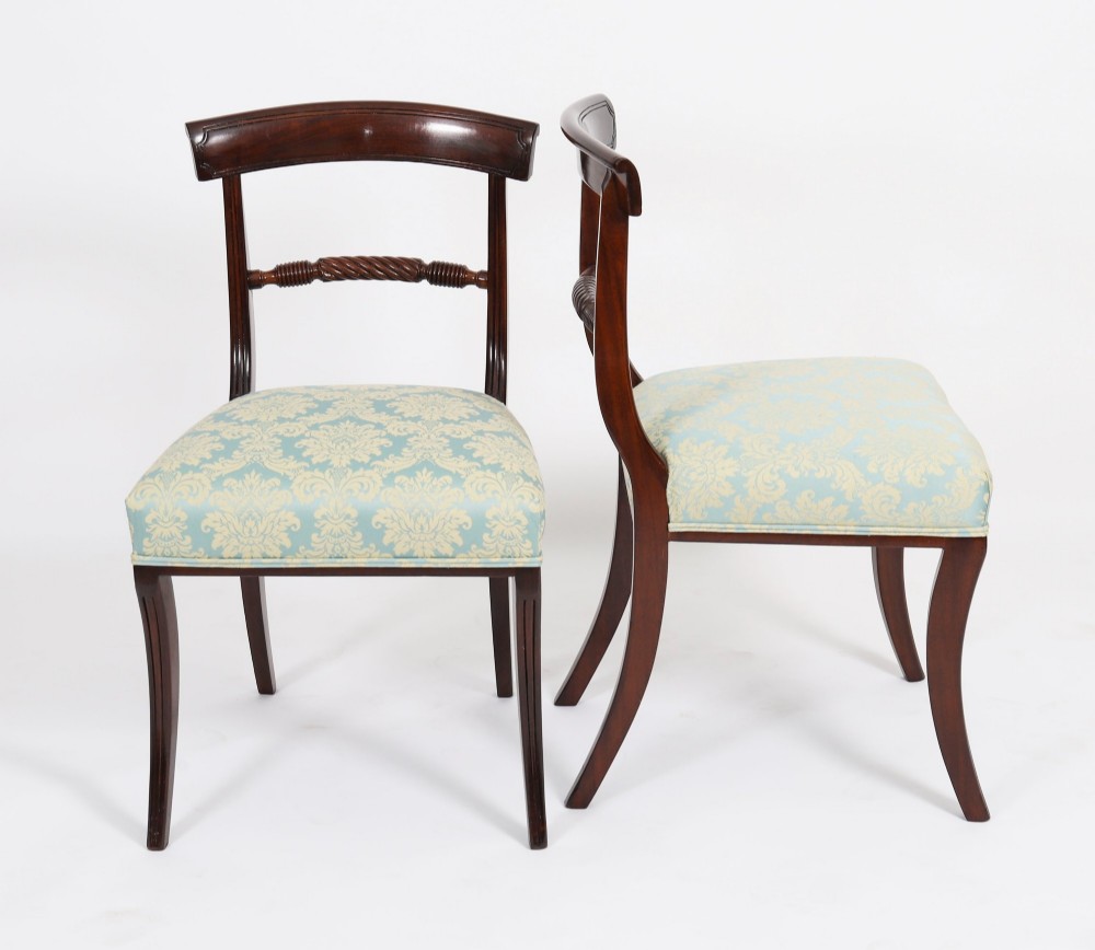 A set of eight Regency mahogany dining chairs, including two carvers, featuring curved top rails, rope-twist splats, and pale blue patterned upholstered seats. View XI