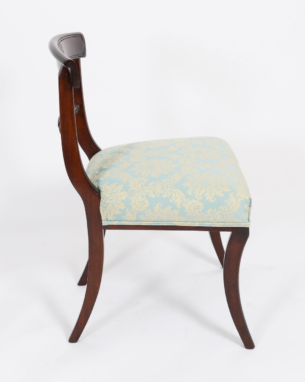 A set of eight Regency mahogany dining chairs, including two carvers, featuring curved top rails, rope-twist splats, and pale blue patterned upholstered seats. View XIV