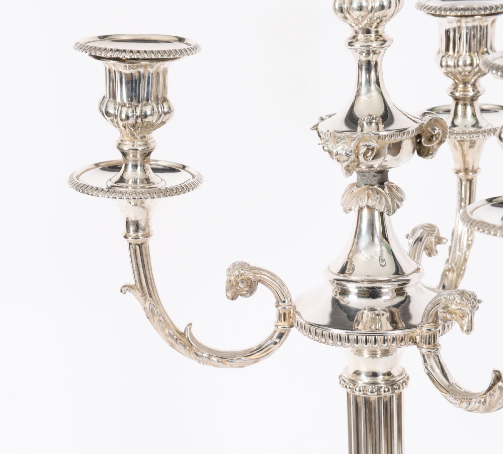 A pair of silver-plated four-light candelabra with fluted columns, scroll branches, and laurel wreath detailing on square bases. View III